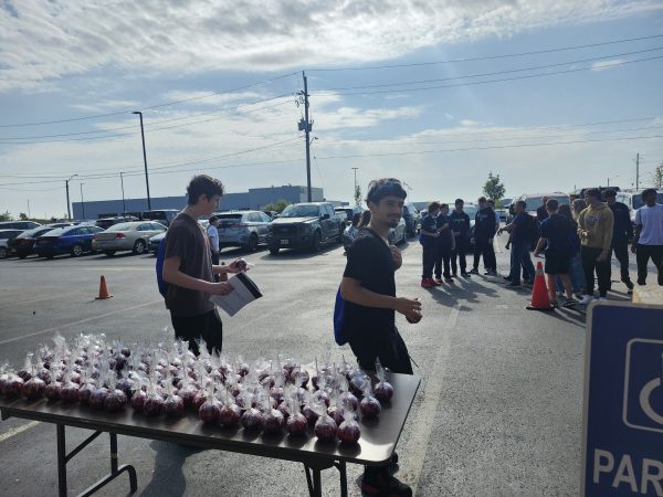 Students picking up their Cavalier Branded Candy Apple on Manufacturing Day.