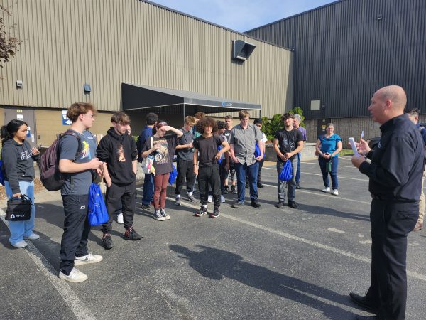 International Business Development Manager Chris Vander Park explains the rules for the day to students on Manufacturing Day