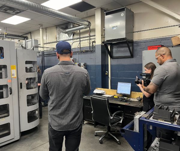 Build a Dream Media Team Filming Cynthia Cooper in Cavalier Tool's EDM Department.