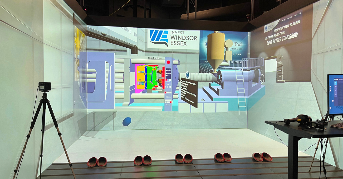 A picture of The Cavalier VR Experience we will display at PTXPO. An animated injection molding machine can be seen in a simulated shop floor environment.